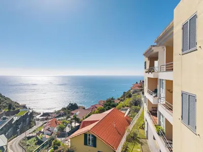 a view of the ocean from a building at Peace Haven II in Calheta