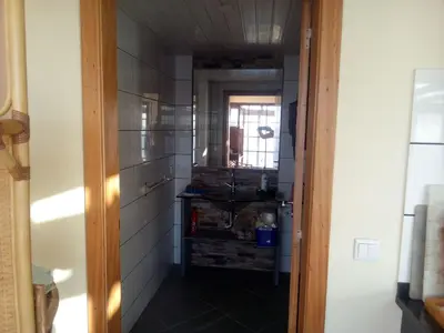 a hallway of a kitchen with a room with at Holiday Home Erdhaus by Interhome in Fajã da Ovelha