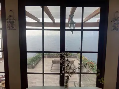 a large window with a view of a patio at Holiday Home Erdhaus by Interhome in Fajã da Ovelha