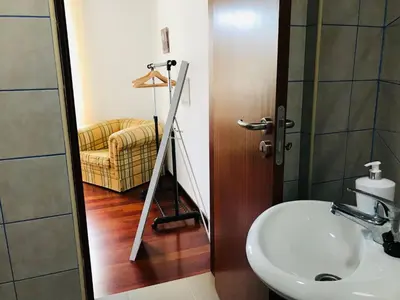 a bathroom with a sink and a mirror at Holiday Home Casa Lugar da Ribeira mit Dachterrasse by Interhome in Campanário