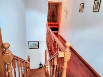 a staircase in a home with wooden railings at Holiday Home Quinta do Serrado by Interhome in Ribeira da Janela