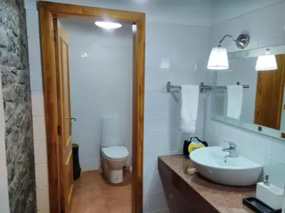 a bathroom with a sink and a toilet at Holiday Home Quinta do Serrado by Interhome in Ribeira da Janela