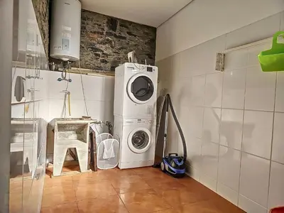 a laundry room with a washer and a washing machine at Holiday Home Quinta do Serrado by Interhome in Ribeira da Janela