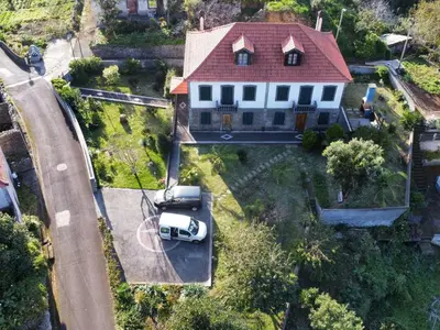 an aerial view of a white house with a red roof at Holiday Home Quinta do Serrado by Interhome in Ribeira da Janela