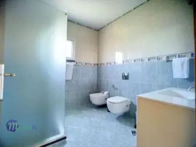 a bathroom with a toilet and a sink at Holiday Home Yohannas Unterkunft by Interhome in Campanário