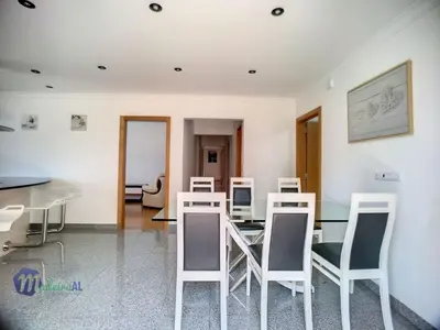 a dining room with white chairs and a table at Holiday Home Yohannas Unterkunft by Interhome in Campanário