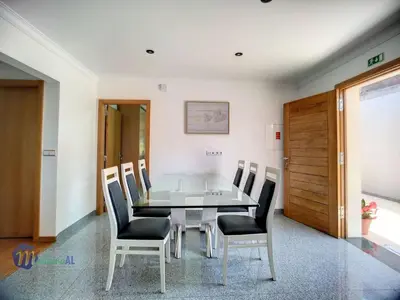 a dining room with a table and chairs at Holiday Home Yohannas Unterkunft by Interhome in Campanário