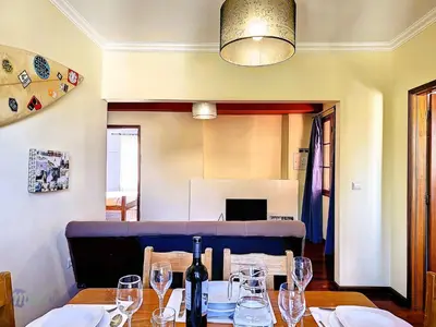 a dining room with a table with wine glasses on it at Apartment Domus Dino by Interhome in Porto da Cruz
