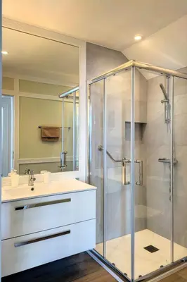 a bathroom with a shower and a sink at Holiday Home Urlaubshaus Vier Generationen by Interhome in Seixal