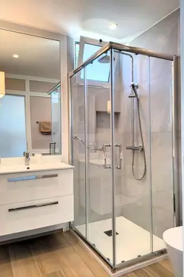 a glass shower in a bathroom with a sink at Holiday Home Urlaubshaus Vier Generationen by Interhome in Seixal