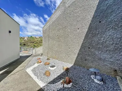 a corner of a building with rocks on the ground at Holiday Home Traumhaus 2- von LSAMadeira by Interhome in Calheta