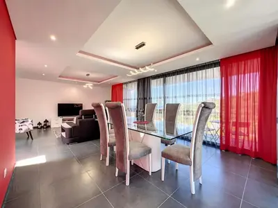 a dining room with a glass table and chairs at Holiday Home Traumhaus 2- von LSAMadeira by Interhome in Calheta