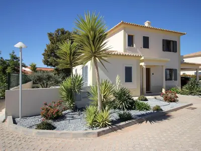 a house with a palm tree in the driveway at Holiday Home Vila Marques da Luz by Interhome in Montinhos da Luz