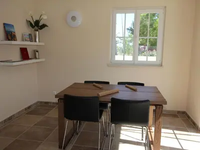 a dining room table with chairs and a window at Holiday Home Vila Marques da Luz by Interhome in Montinhos da Luz