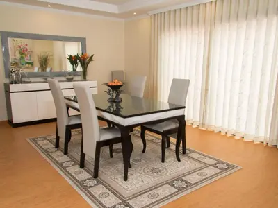 a dining room with a black table and chairs at Holiday Home Elegantes Haus in Santana mit Garten und Grill by Interhome in Santana