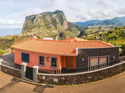 a house on top of a hill with the ocean at Holiday Home Elegantes Haus in Santana mit Garten und Grill by Interhome in Santana