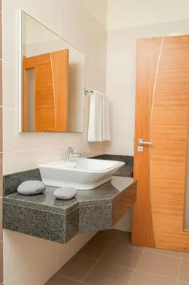 a bathroom with a sink and a mirror at Holiday Home Elegantes Haus in Santana mit Garten und Grill by Interhome in Santana