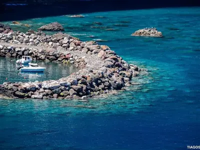 a small island in the water with boats on it at Holiday Home Elegantes Haus in Santana mit Garten und Grill by Interhome in Santana