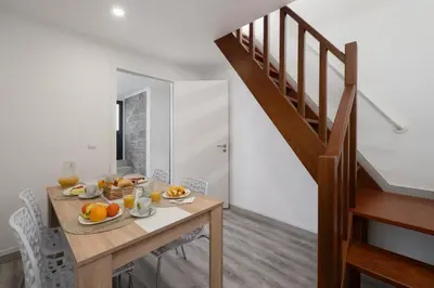a dining room with a table with fruit on it at OurMadeira - Casa da Vinha in Câmara de Lobos
