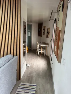 a living room with a couch and a table at O Refúgio in Calheta