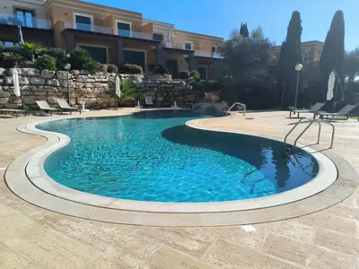 a swimming pool in the middle of a courtyard at Casa Amarillo in Lagos