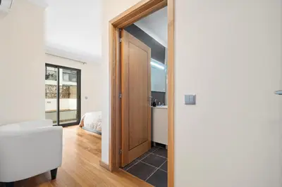 a room with a door leading to a bedroom at Lido Retreat Apartment in Funchal