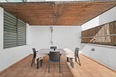 a dining room with a table and chairs at Lido Retreat Apartment in Funchal