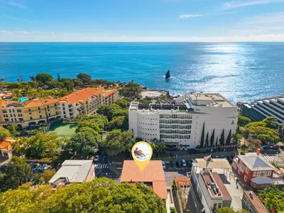 an aerial view of a city and the ocean at Lido Retreat Apartment in Funchal