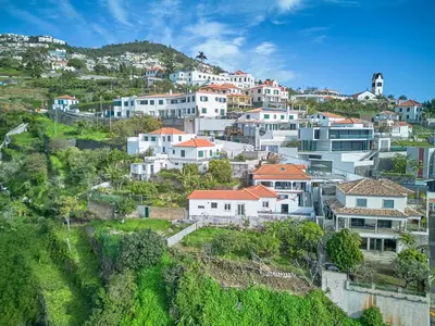 a village on a hill with white houses at S&I Chillhouse Funchal in Funchal