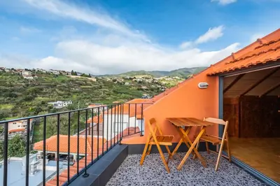 a balcony with a view of the ocean at Casa da Feira in Calheta