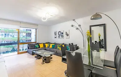 a living room with a couch and a table at MG Hollidays - Av Infante Funchal in Funchal