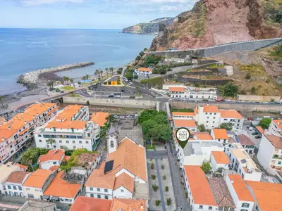 an aerial view of a town next to the ocean at Reis by KAAMAH in Ribeira Brava