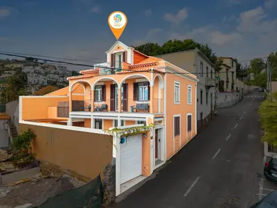 an orange building with a balloon on top of it at Casa NOLA by Susys Holidays in Funchal