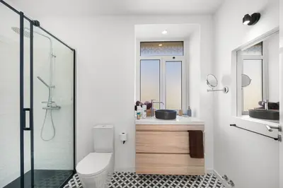 a bathroom with a toilet and a sink and a shower at Casa NOLA by Susys Holidays in Funchal