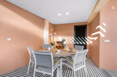 a dining room with a table and chairs at Casa NOLA by Susys Holidays in Funchal