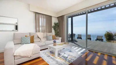 a view from the balcony of a house at DuskLine Villa in Arco da Calheta