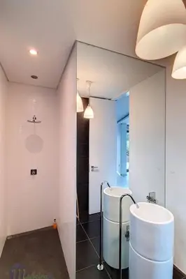 a bathroom with a sink and a mirror at Holiday Home VILLA BONSAI by Interhome in Arco da Calheta