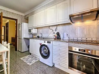 a kitchen with white cabinets and a dishwasher at Apartment Caniço Zentrum Wohnung by Interhome in Caniço