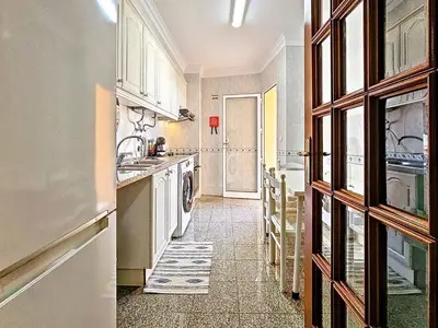 a kitchen with a sink and a dishwasher at Apartment Caniço Zentrum Wohnung by Interhome in Caniço