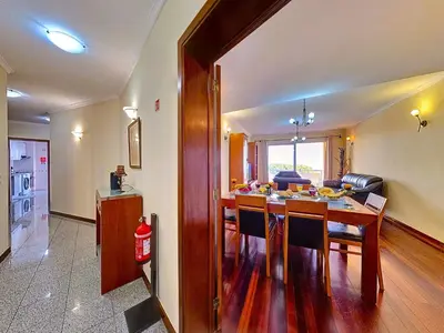 a kitchen and dining room with a table and chairs at Apartment Caniço Zentrum Wohnung by Interhome in Caniço