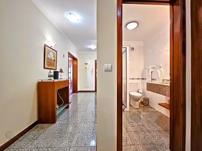 a bathroom with a toilet and a sink at Apartment Caniço Zentrum Wohnung by Interhome in Caniço