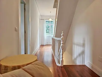 a stairway with a round table and a stair case at Holiday Home Quinta do Serrado 2 by Interhome in Ribeira da Janela