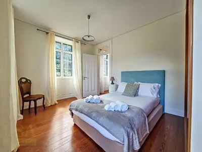 a bedroom with a bed with two towels on it at Holiday Home Quinta do Serrado 2 by Interhome in Ribeira da Janela