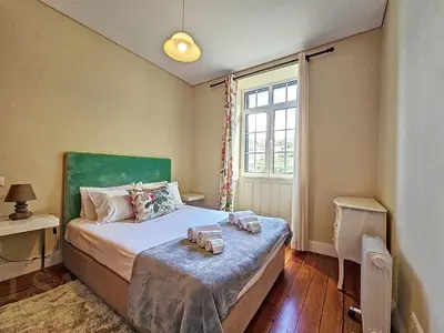 a bedroom with a bed and a window at Holiday Home Quinta do Serrado 2 by Interhome in Ribeira da Janela