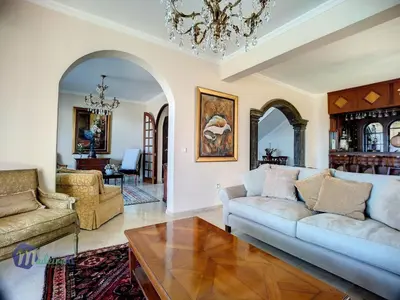 a living room with a couch and a table at Holiday Home PEARLS BEACH VILLA by Interhome in Porto Moniz