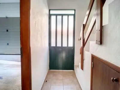 a hallway with a green door in a house at Holiday Home Casa do Romaninho by Interhome in Porto da Cruz