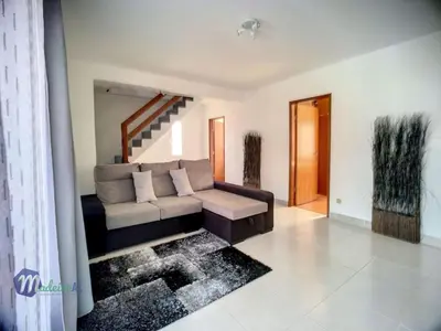 a living room with a couch and a staircase at Holiday Home Casa do Romaninho by Interhome in Porto da Cruz