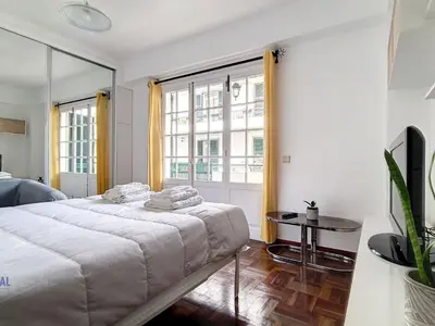 a bedroom with a bed and a large window at Apartment Wohnung in Funchal- in der Nähe von Farmers Market by Interhome in Funchal