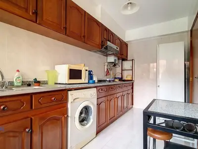 a kitchen with a washing machine and a microwave at Apartment Wohnung in Funchal- in der Nähe von Farmers Market by Interhome in Funchal