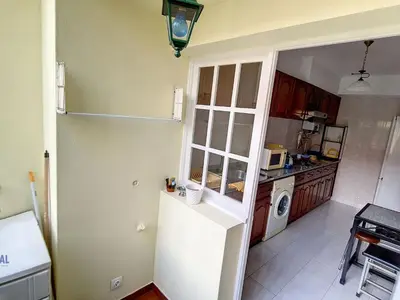 a kitchen with a white refrigerator and a washer at Apartment Wohnung in Funchal- in der Nähe von Farmers Market by Interhome in Funchal